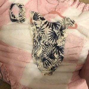 Romper with headband. This item was hardly worn.